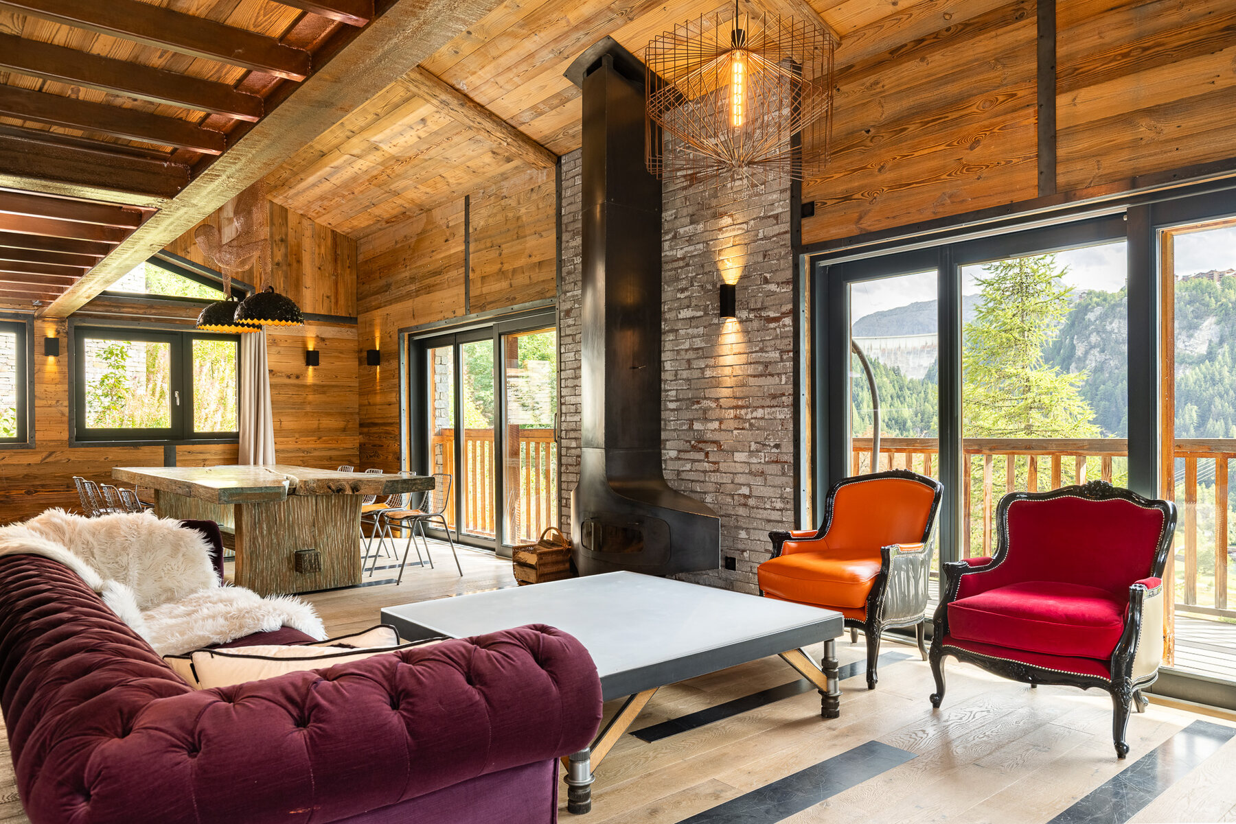 Chalet Gallery's lounge in Tignes, with a wood-burning stove and street art on the walls