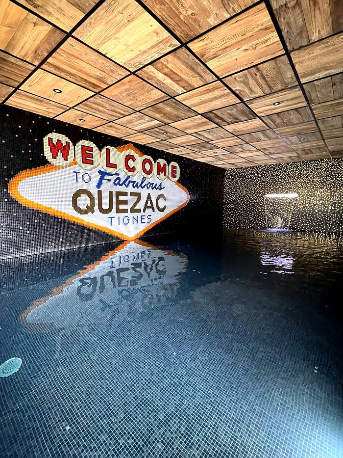 Chalet Mirage's indoor mosaic pool in Tignes, lit with a Las Vegas-style illuminated mural