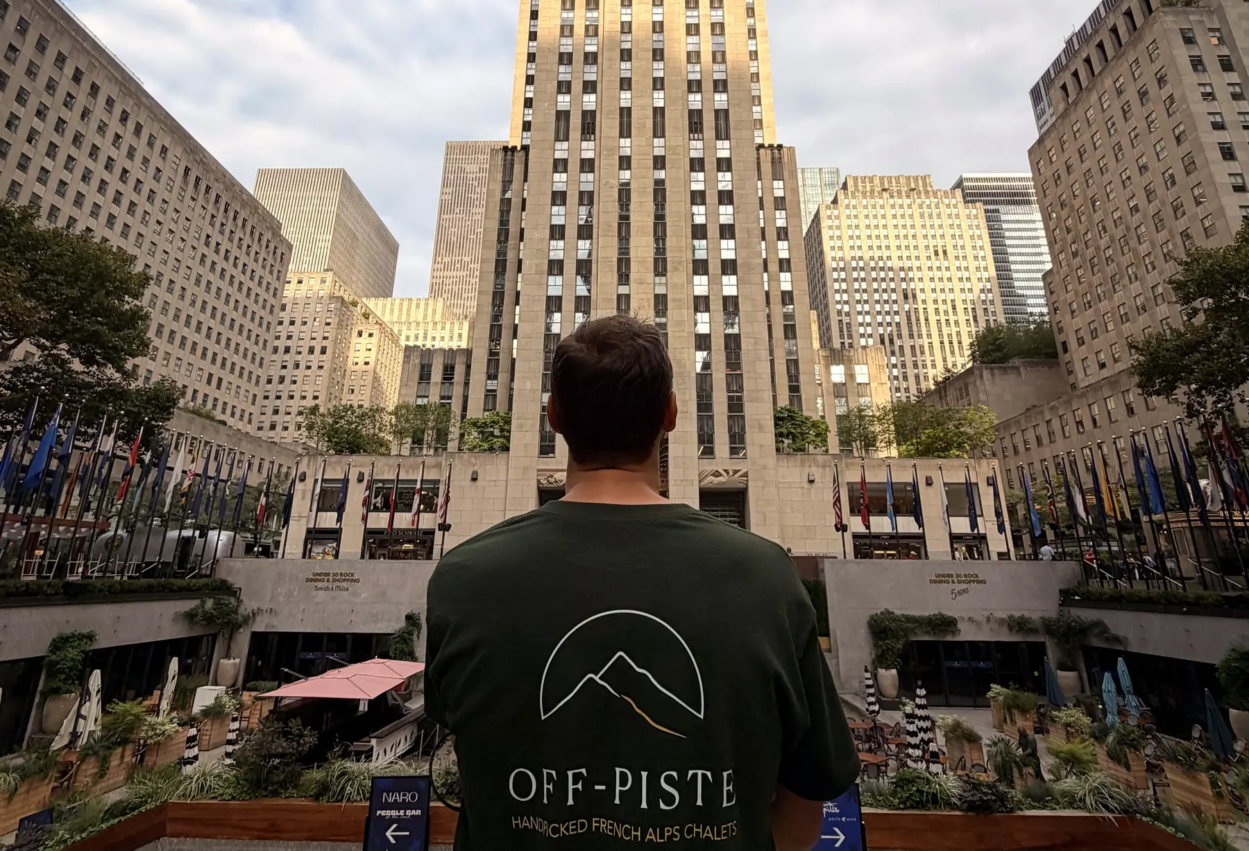 Thomas, OFF-PISTE's founder, at Rockefeller Center in New York, wearing the OFF-PISTE tee